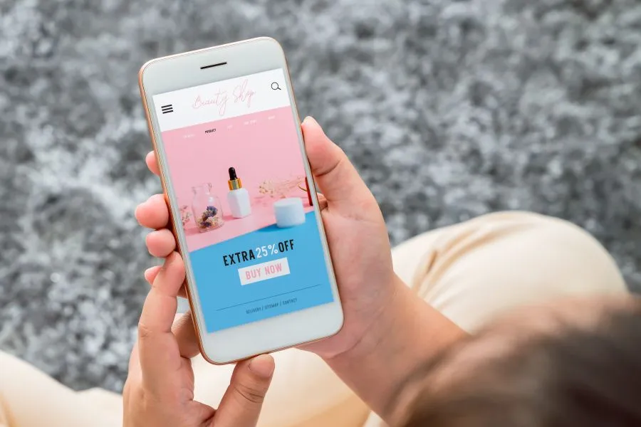 A phone with a beauty shop on it.